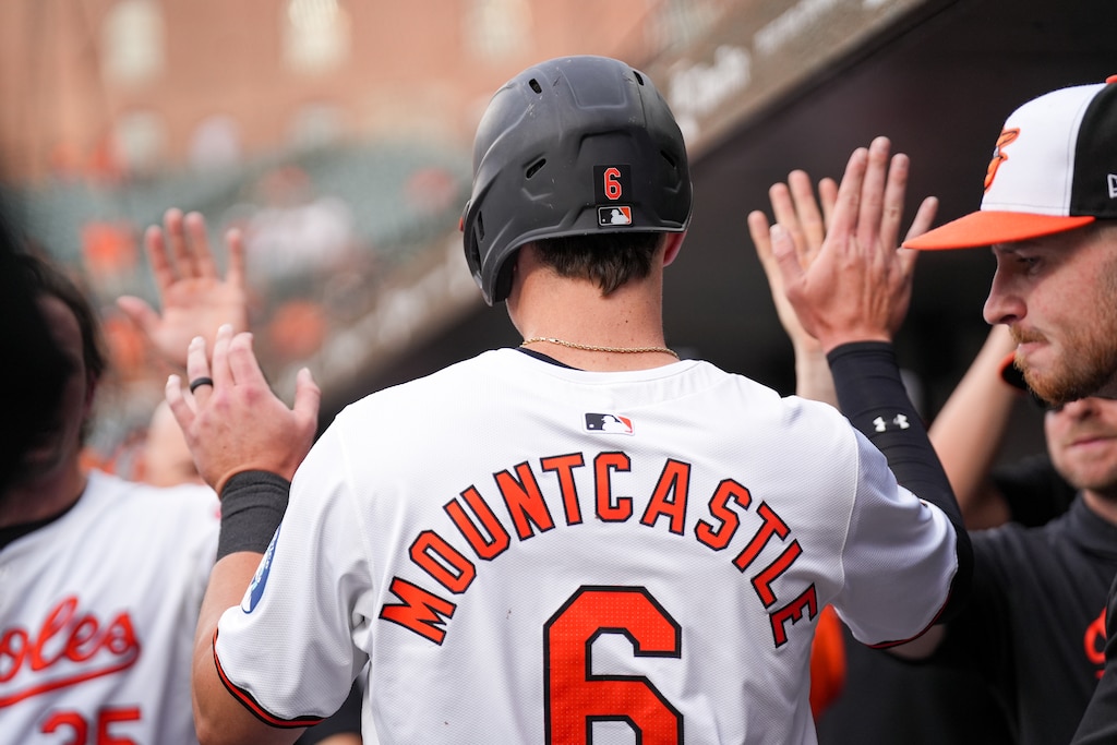 Baltimore Orioles first baseman Ryan Mountcastle (6) high fives teammates in the dugout after scoring in the second game of a series against the Cleveland Guardians at Camden Yards on June 25, 2024.