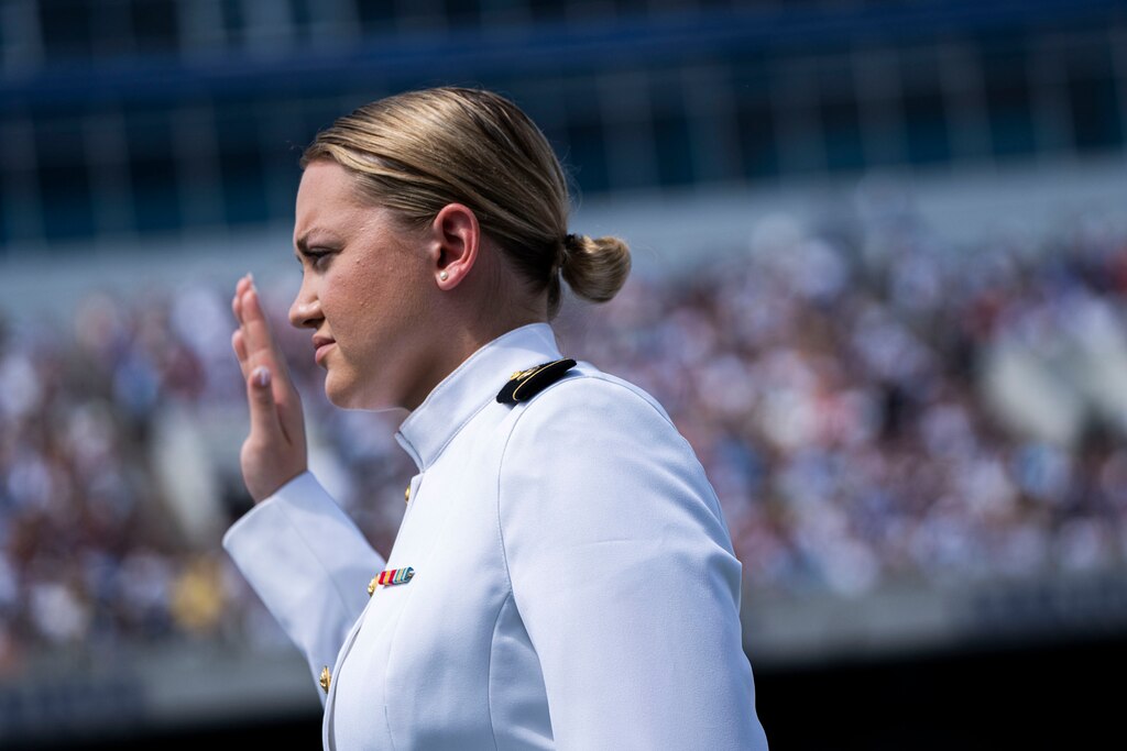 Graduates take the oath to become a commissioned officer.