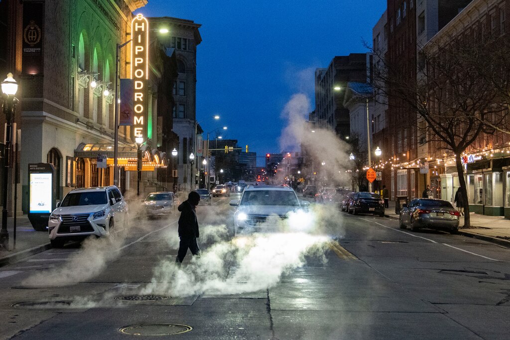 A pedestrian crosses N Eutaw Street in Baltimore on March 15, 2024.