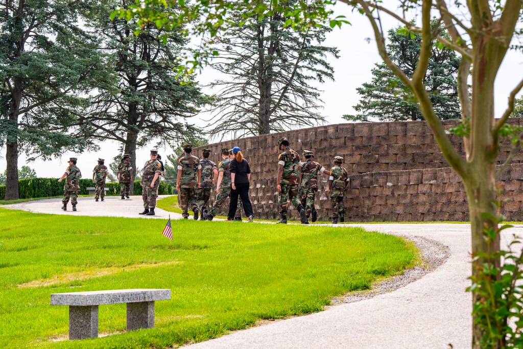 Members of the Jarrettsville and Historic Elkridge Young Marines walk through Dulaney Valley Memorial Gardens in Timonium on May 25, 2024.