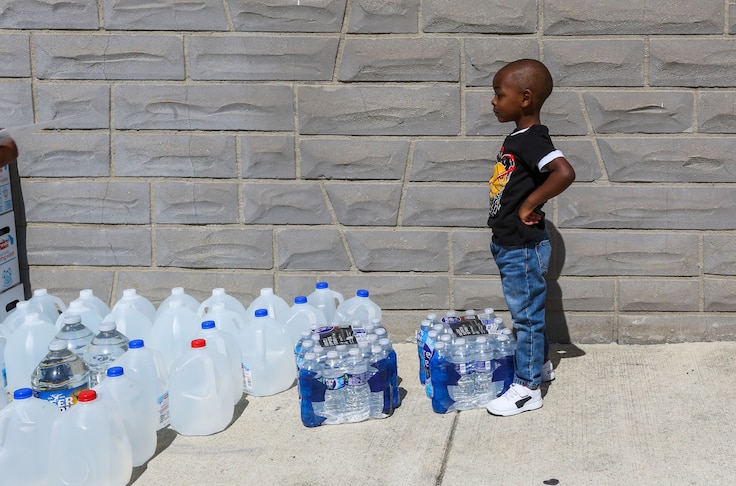 Bryson Mason, 3, does his part to help distribute water. Maryland Candidate for Governor Dan Cox stops in West Baltimore to distribute water to the communities affected by the E.coli scare. He was assisted by Maryland House of Delegrates candidate Zuleika Baysmore, District 40.