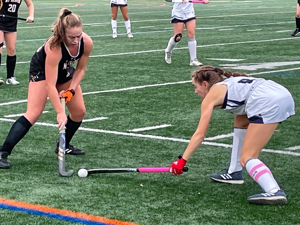 Mount Hebron’s Natalie Machiran (left) attempts to play a ball stopped by Marriotts Ridge’s Marin Kriner during Wednesday’s Class 3A East Region I field hockey championship. Macharin scored Mount Hebron’s only goal as top-seeded Marriotts Ridge won, 3-1.