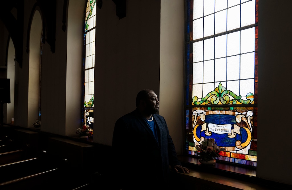 Rev. Derrick DeWitt, pastor of First Mount Calvary Baptist Church poses for a portrait inside of the church in Baltimore, Wednesday, May 15, 2024.