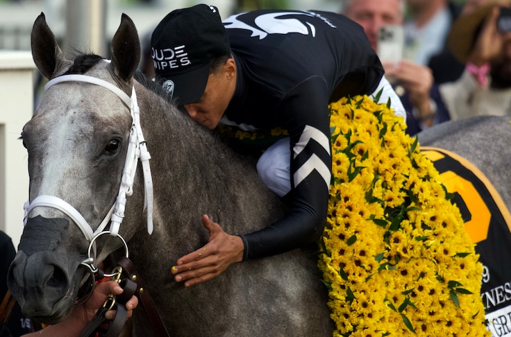 Jockey Jaime Torres celebrates after guiding Seize the Grey to a win in The Preakness Stakes.