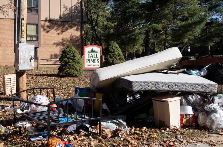 Belongings of Sharnae Hunt left on the side of the road by movers and apartment staff after a wrongful eviction, at Tall Pines apartment, in Glen Burnie, Tuesday, November 22, 2022.