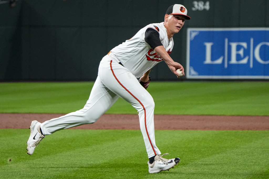 Baltimore Orioles relief pitcher Tyler Wells (68) tosses the ball to first base during a game against the Boston Red Sox on Thursday, September 28, 2023. The Baltimore Orioles secured a division title for the team for the first time since 2014.