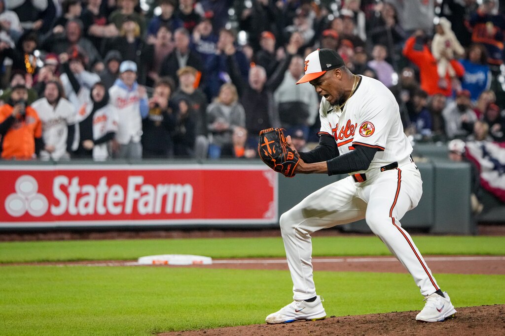 Baltimore Orioles relief pitcher Yennier Cano (78) pounds his glove after throwing a scoreless inning in a game against the Kansas City Royals at Camden Yards on April 1, 2024. The Orioles beat the Royals, 6-4, on Monday night.