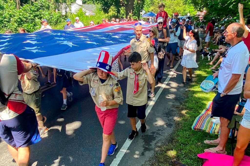 As many as 50 volunteers carry the 30-by-60 Nathaniel McDavitt Flag during the Severna Park Independence Day Parade. The giant Stars and Stripes is displayed every year in memory of a 2011 Severna Park High School graduate who died in Jordan while serving in 2016.