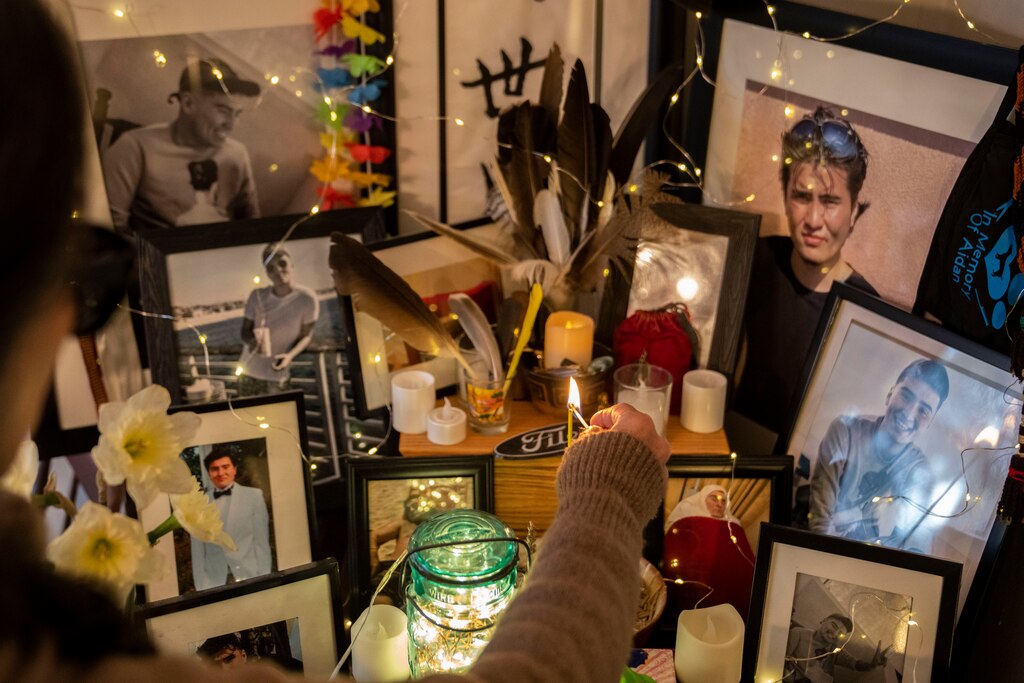 Lisa Filer lights incense at an alter dedicated to her son Aidan Filer inside of her home in Baltimore, MD on March 22, 2024. Aidan Filer passed away from an overdose in 2020.